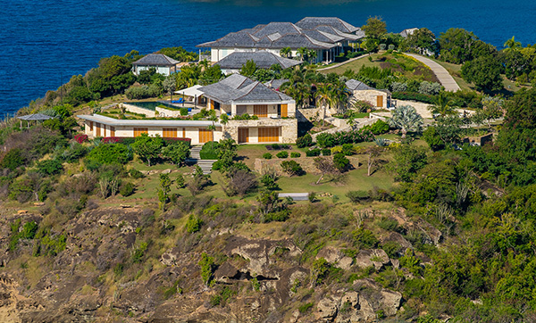 luxurious hillside property overlooking ocean with three beautiful homes and landscaped garden